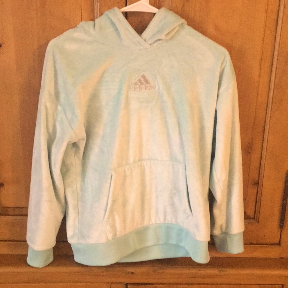 Light blue Adidas hoodie.